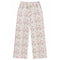 A pair of wide-leg pants featuring an all-over pink bow and gray branch pattern on a cream background, with a matching cream drawstring waistband.