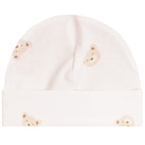 A soft cream-colored baby beanie hat featuring a repeating pattern of small teddy bear faces in beige and light brown, shown against a plain white background.