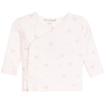 A baby long-sleeve wrap top in off-white with a delicate pink bow and heart pattern, shown flat against a white background.