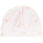 A white knit baby beanie hat with a soft pink bow and heart pattern, shown flat against a white background.