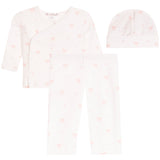 A three-piece baby clothing set including a long-sleeve wrap shirt, leggings, and a beanie hat, all in a soft off-white fabric with a small pink bow and heart pattern.