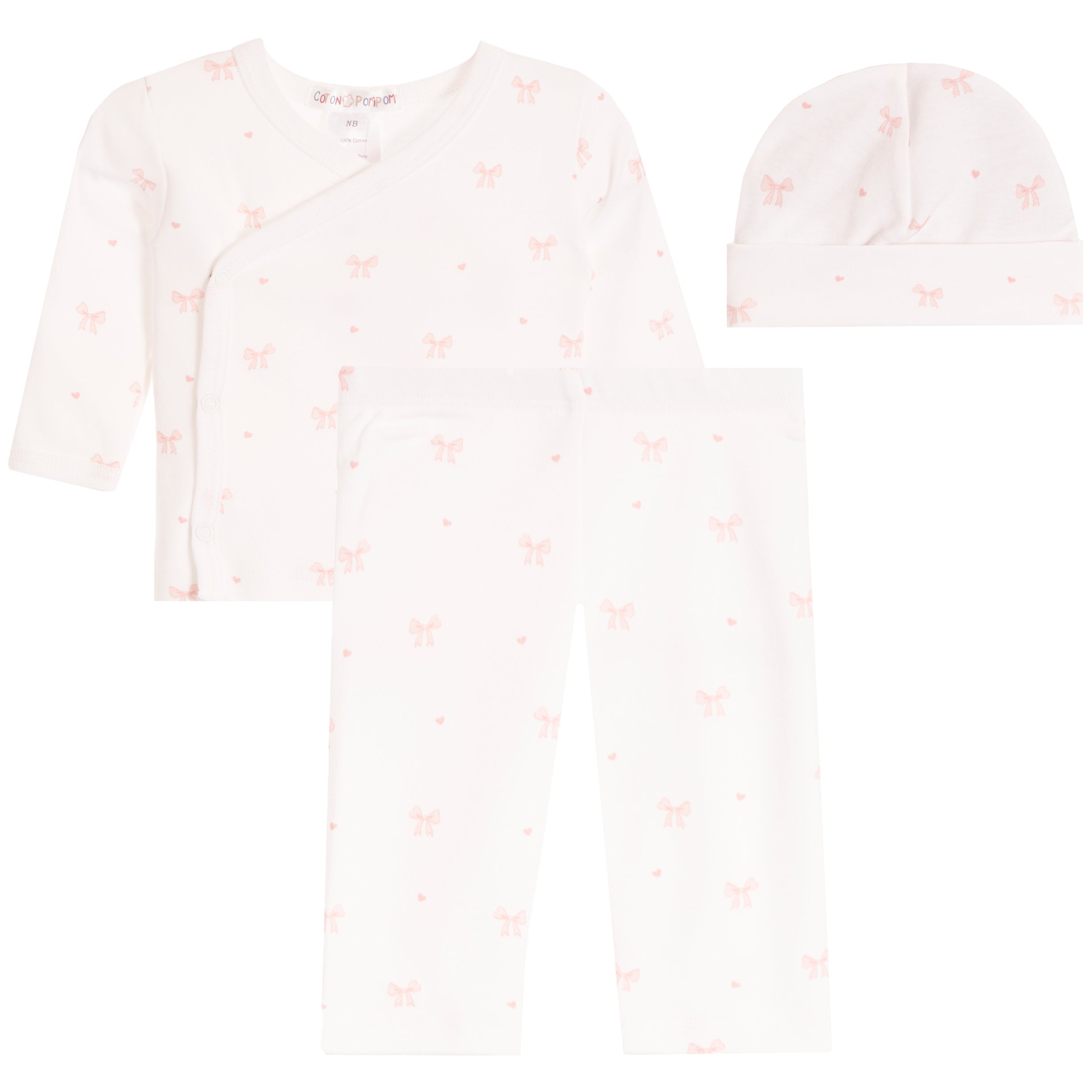 A three-piece baby clothing set including a long-sleeve wrap shirt, leggings, and a beanie hat, all in a soft off-white fabric with a small pink bow and heart pattern.