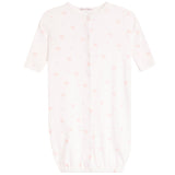 A baby sleep sack in white with a delicate pink bow and heart pattern, featuring short sleeves, a snap-button front, and an elasticated hem.