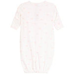A baby long-sleeve sleep sack in white with a delicate pink bow and heartpattern, shown flat against a white background.