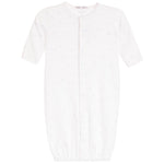 A white short-sleeve baby sleep sack with a subtle all-over light blue star pattern, featuring a front snap closure and elastic cuffs.