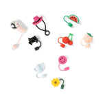 A set of colorful silicone Straw Toppers shaped like a pink cowboy hat, watermelon slice, cherries, peach, smiley face, teapot, and sunflower, arranged on a plain white background.