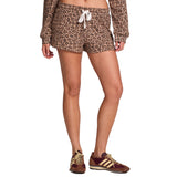 A model wearing leopard-print shorts with a white drawstring and a matching long-sleeve top, paired with brown and gold sneakers, shown against a plain white background.