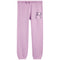 Purple jogger sweatpants with a bow and heart design on the leg against a white background