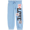 Light blue jogger sweatpants with a vertical 'LOVE' text print and decorative patchwork details on the left leg, including bows and the number '22'.