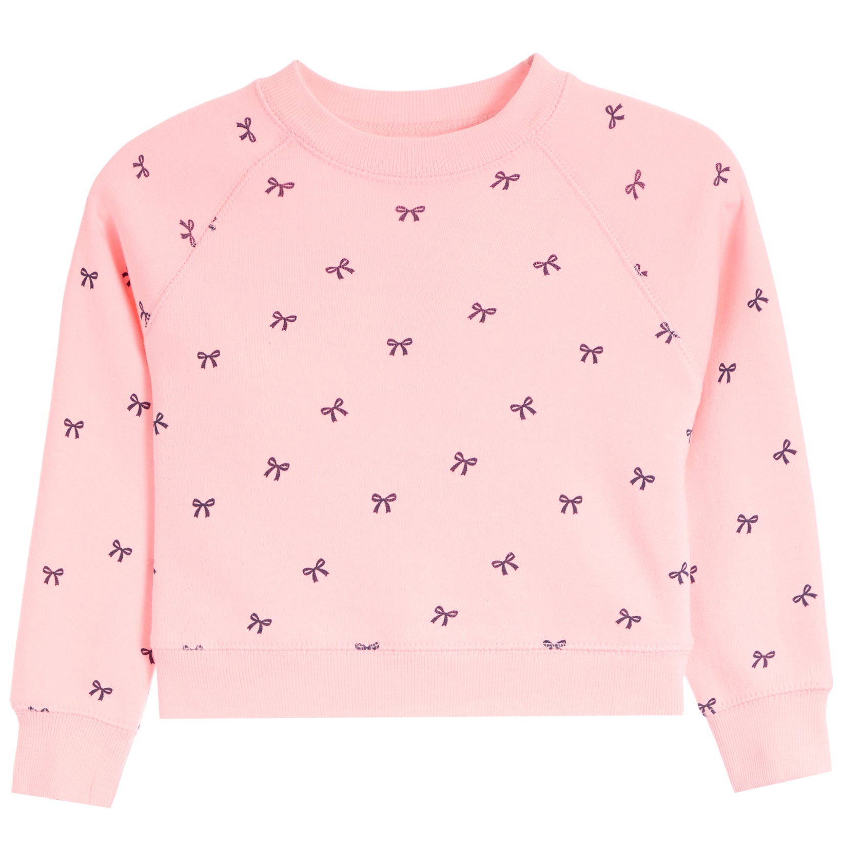 A light pink long-sleeve crewneck sweatshirt for toddlers, featuring an all-over pattern of small black bows, shown flat on a white background.