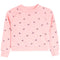 A light pink long-sleeve crewneck sweatshirt for toddlers, featuring an all-over pattern of small black bows, shown flat on a white background.