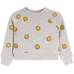 A light gray heather crewneck sweatshirt with an all-over yellow smiley face pattern, shown flat against a white background.