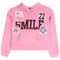 A pink long-sleeve hoodie with a front kangaroo pocket, featuring decorative patches and appliques including the word 'SMILE' in black, cherries, the number 22, a bow, and a star.
