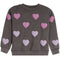 A dark gray crewneck sweatshirt with multiple textured, raised chenille heart patches in pink and light purple, displayed on a solid white background.
