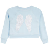 A light blue sweatshirt with long raglan sleeves, featuring a large white rhinestone-embellished angel wings design on the back.