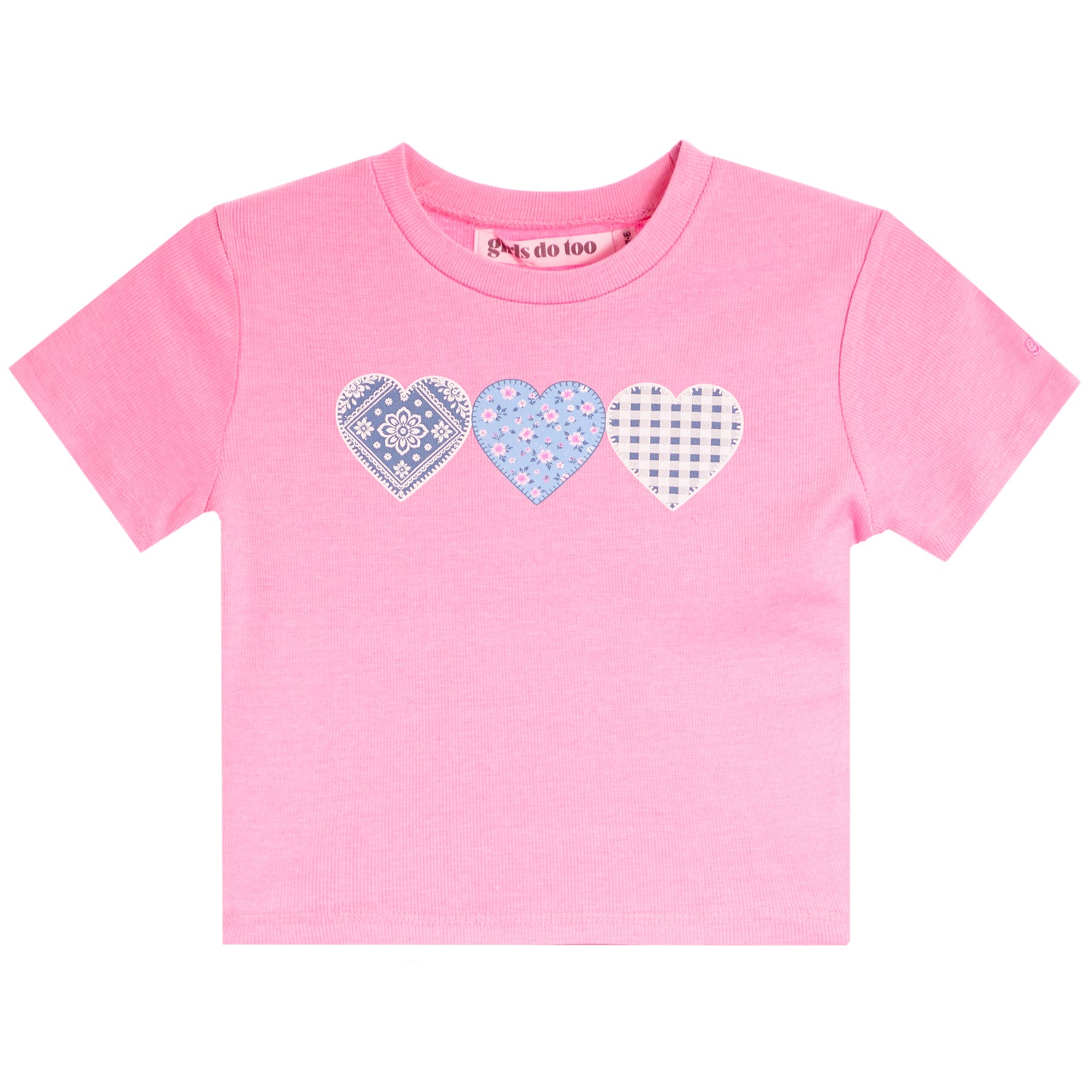 A pink short-sleeve kids' t-shirt with three patterned heart graphics across the chest. The hearts feature blue and white patterns, including paisley, floral, and gingham.
