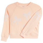 A light peach crewneck sweatshirt with white embroidered bow patterns on the front and sleeves, displayed flat against a white background.