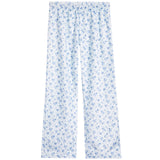 White lounge pants with a blue floral pattern, featuring an elastic waistband and a relaxed straight-leg fit.