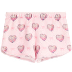 Pink fleece shorts with a repeating pattern of glittery hearts and small bows.
