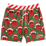 Green swim trunks with an all-over red basketball wearing a Santa hat pattern, a red and white striped waistband, and white drawstrings. A green 'Bigger Than Basketball' logo is printed on the lower right leg.