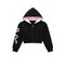 black cropped hoodie with white bow graphic on the sleeve against a solid white background.