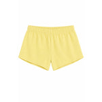 A pair of light yellow athletic shorts with an elastic waistband, shown flat against a solid white background.