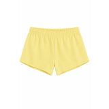 A pair of light yellow athletic shorts with an elastic waistband, shown flat against a solid white background.