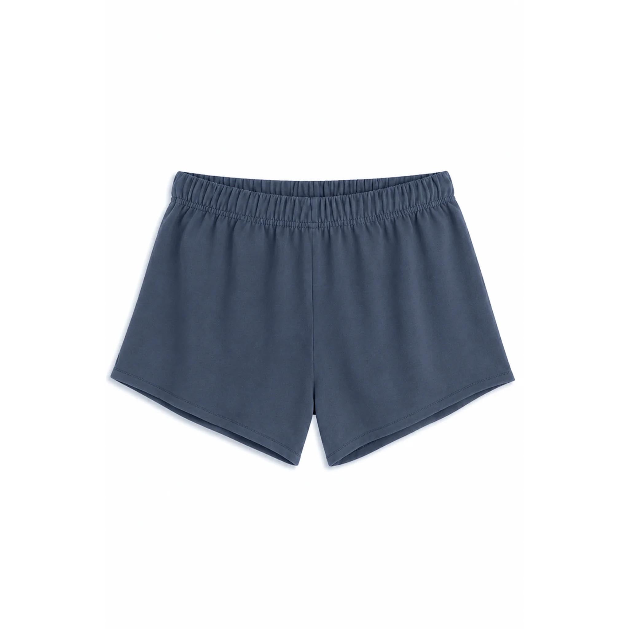 A pair of slate blue athletic shorts with an elastic waistband, shown flat against a solid white background.
