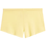 A pair of light yellow athletic shorts with an elastic waistband, shown flat against a plain white background.