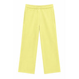 A pair of light yellow wide-leg sweatpants with an elastic waistband and side pockets, shown flat against a solid white background.