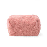 Pink fluffy pouch on a white background