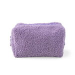 A lavender purple bouclé cosmetic pouch with a top zipper, shown on a clean white background.