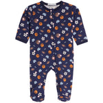 A baby's long-sleeve footed sleeper in navy blue, featuring an all-over print of sports balls and gloves in orange, brown, white, and light blue. The sleeper has a front zipper and is shown flat against a white background.