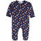 A baby's long-sleeve footed sleeper in navy blue, featuring an all-over print of sports balls and gloves in orange, brown, white, and light blue. The sleeper has a front zipper and is shown flat against a white background.