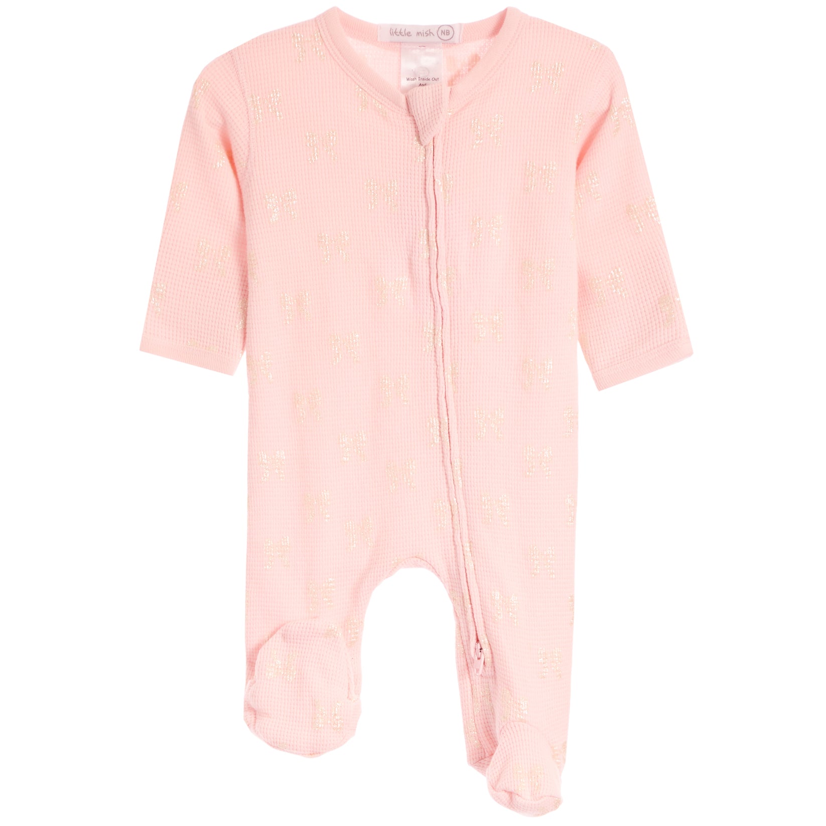 A light pink baby footed sleeper with a subtle gold bow pattern, featuring a front zipper and short sleeves, shown on a plain white background.