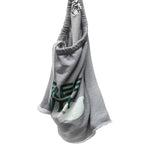 A gray shorts with a green and white graphic print, featuring a drawstring strap with 'FREE CITY' printed on it, set against a plain white background.