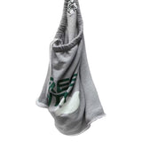 A gray shorts with a green and white graphic print, featuring a drawstring strap with 'FREE CITY' printed on it, set against a plain white background.