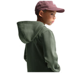 A child wearing a dark olive green hooded sweatshirt and a maroon baseball cap, shown from a side-back angle against a plain white background.