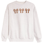 A light heather gray crewneck sweatshirt featuring three brown ribbon-bow motifs across the chest, displayed on a clean white background.