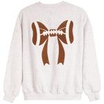 A light heather gray crewneck sweatshirt featuring a large brown graphic of a football tied in a bow on the back.