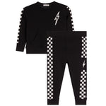 A two-piece kids' outfit set consisting of a black long-sleeve sweatshirt and matching jogger pants, both featuring a white lightning bolt graphic and a black-and-white checkered stripe down the sleeve and leg.