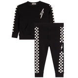 A two-piece kids' outfit set consisting of a black long-sleeve sweatshirt and matching jogger pants, both featuring a white lightning bolt graphic and a black-and-white checkered stripe down the sleeve and leg.