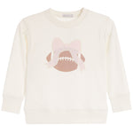 An off-white long-sleeve crewneck sweatshirt featuring a graphic of a brown football with white laces and a light pink bow on the front.