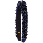 A dark navy blue velvet headband embellished with black sequins and beads, shown against a plain white background.
