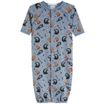 A baby long-sleeve footless sleeper in light blue with an all-over football and helmet print, featuring a snap-button front closure.