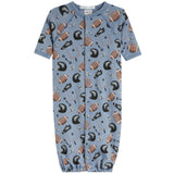 A baby long-sleeve footless sleeper in light blue with an all-over football and helmet print, featuring a snap-button front closure.