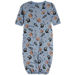 A baby short-sleeve footless sleeper in light blue with an all-over football-themed print of brown footballs, black helmets, and play icons, shown on a plain white background.