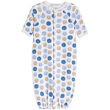 A baby sleep sack with short sleeves and a front snap closure, featuring an all-over pattern of blue and tan smiley faces on a white background.