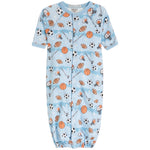 A baby long-sleeve sleep sack with a light blue watercolor background and an all-over sports-themed print featuring basketballs, footballs, soccer balls, and whistles. The sleep sack has a snap-button front and elastic cuffs.