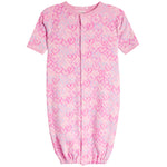 A baby long-sleeve footless sleeper in light pink with an allover pattern of darker pink and white hearts.